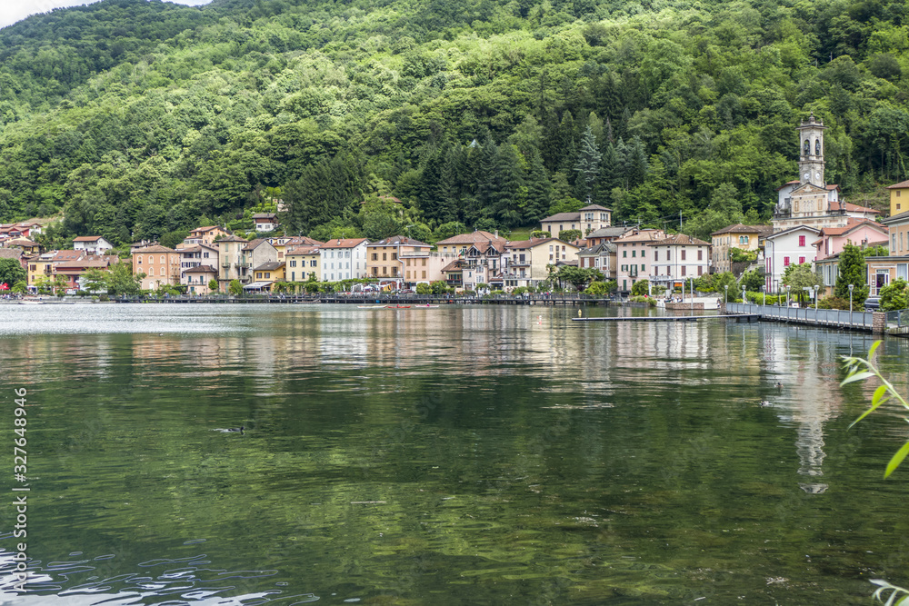 Fototapeta premium Lakefront of Porto Ceresio with flowers and colored houses