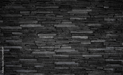 Texture of black brick slate wall, dark grey stone background