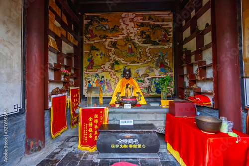 Altar for prayers with the figure of the buddha as a tribute to the prince in Taizi Po Temple (Fuzheng Guan complex) Wudang Mountain, Wudang, Hubei province, China photo