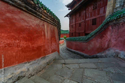 Ancient Prince Slope. Red walls and winding path built in stone leads to Taizi Po Temple in Wudang Mountains, Hubei province, China photo