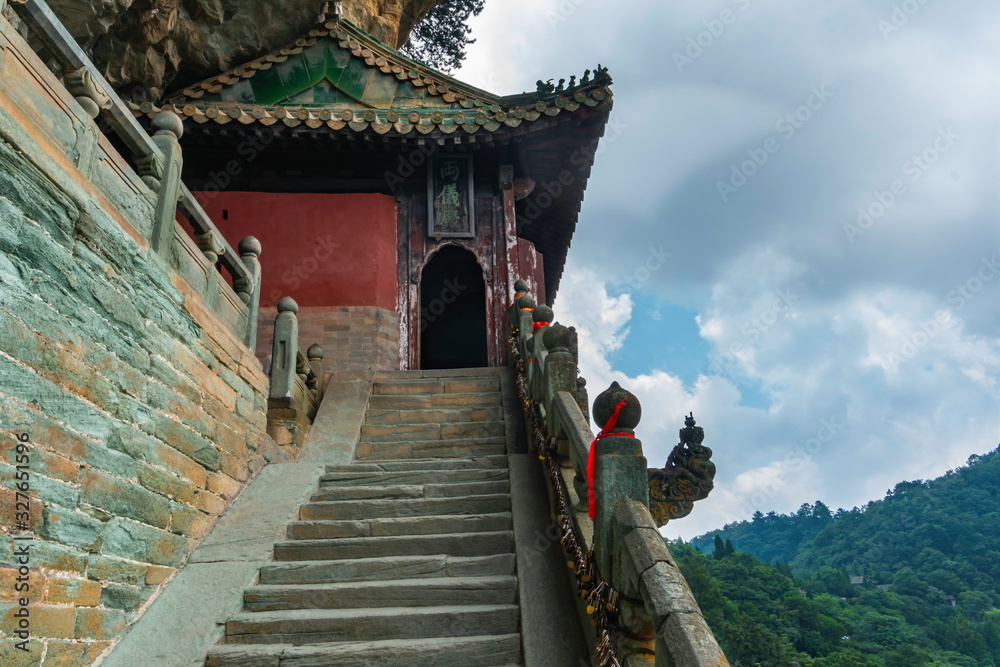 Danan Rock scenic spot. Temple with burning dragon head incense in Liangyi, Nanyan Palace. Wudang Mountain, Hubei province, China (text: Liangyi building) Danan Rock scenic spot. Temple with burning dragon head incense in Liangyi, Nanyan Palace. Wudang Mountain, Hubei province, China (text: Liangyi building)