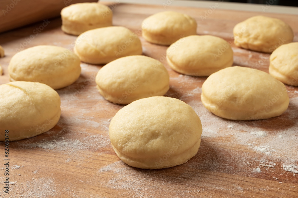 Preparation of doughnuts filled with marmalade from yeast dough