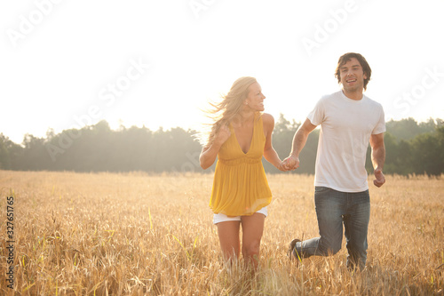 Happy young couple in love enjoying a summer day