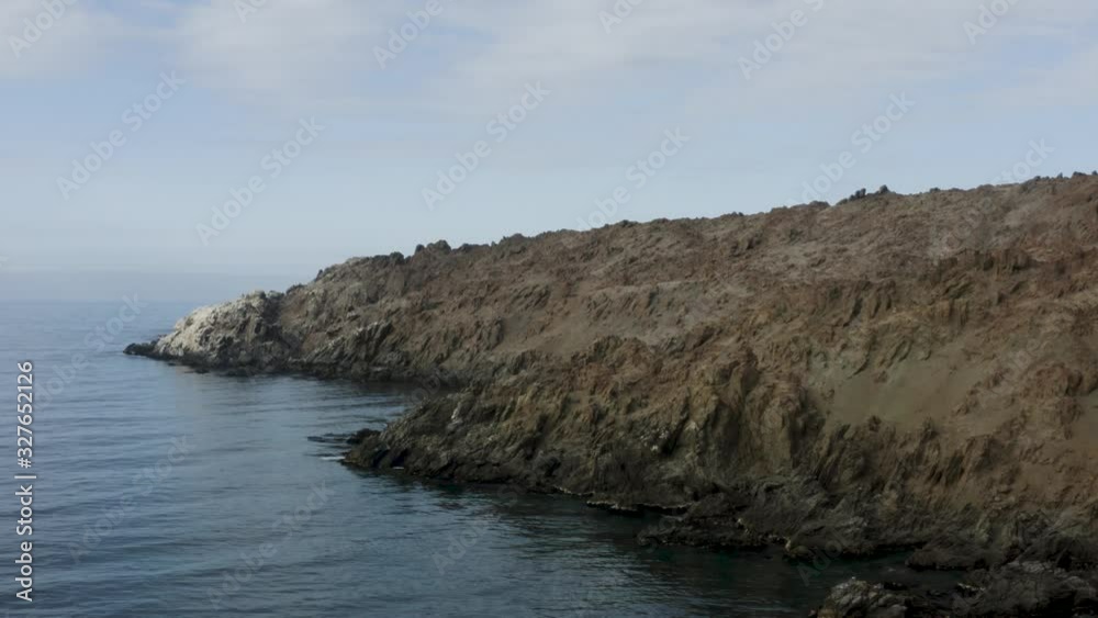 Beautiful aerial view of a calm and peaceful beach called Puerto Inca, located in Peru. Drone taking height. Beautiful aerial view of a calm and peaceful beach called Puerto Inca, located in Peru. Drone taking height.
