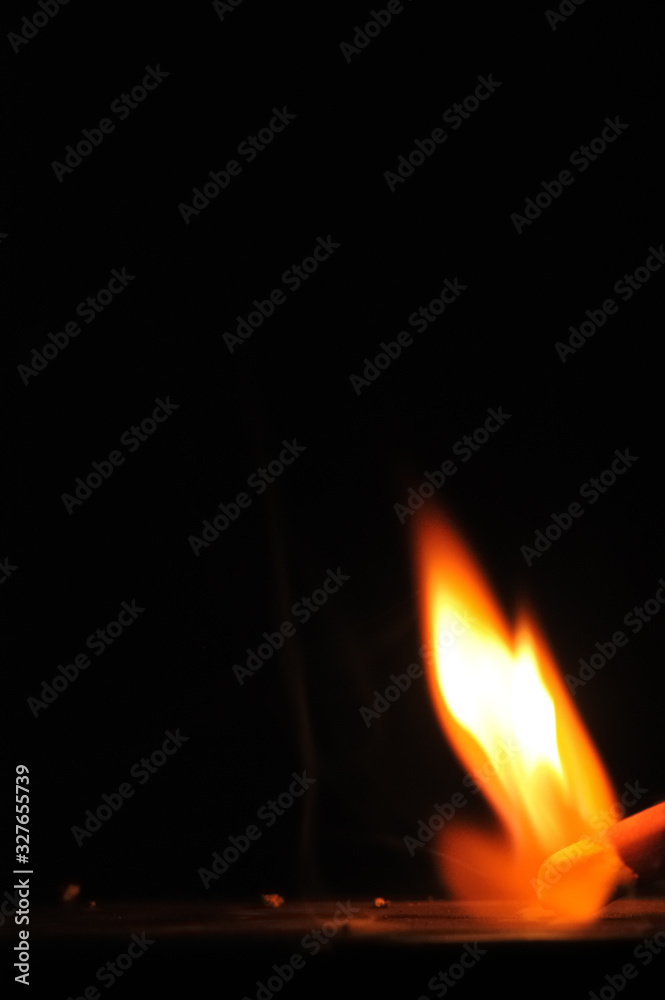 Matchstick ignites with the help of the matchbox with beautiful flames and smoke. Matchstick ignites with the help of the matchbox with beautiful flames and smoke.