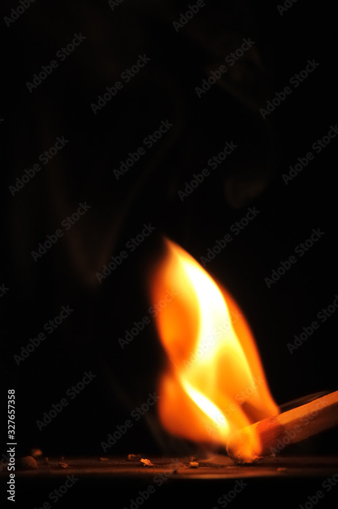 Matchstick ignites with the help of the matchbox with beautiful flames and smoke. Matchstick ignites with the help of the matchbox with beautiful flames and smoke.