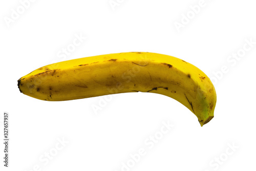 One ripe yellow banana on a white background. Close up.