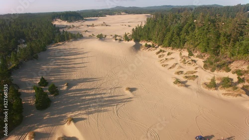 Oregon Coast circa-2019.  Aerial view of sand dunes on Oregon Coast.  Shot from helicopter with cineflex gimal and RED 8K camera. photo