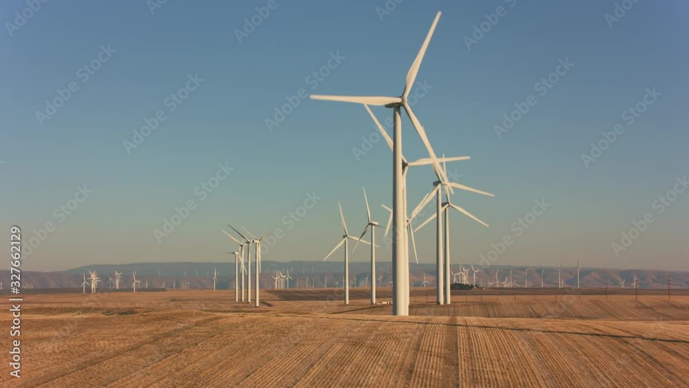 Tracking shot of energy producing wind turbines in Oregon. 