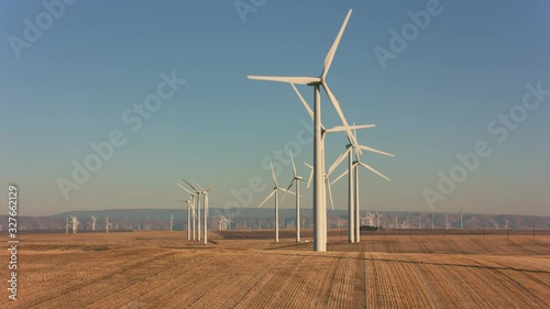 Tracking shot of energy producing wind turbines in Oregon. 