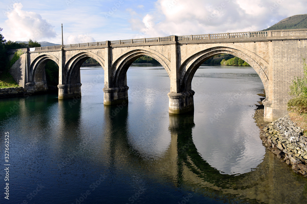 Fototapeta premium Portochao bridge, bridge of the railroad track, on the Landro river in the city of Viveiro, Lugo, Galicia. Spain. Europe. October 06, 2019