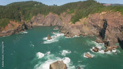 Oregon Coast circa-2019.  Aerial view of rocky coastline.  Shot from helicopter with cineflex gimal and RED 8K camera. photo