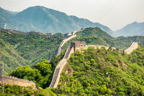 Fototapeta Panorama of Great Wall of China among the green hills and mountains near Beijing