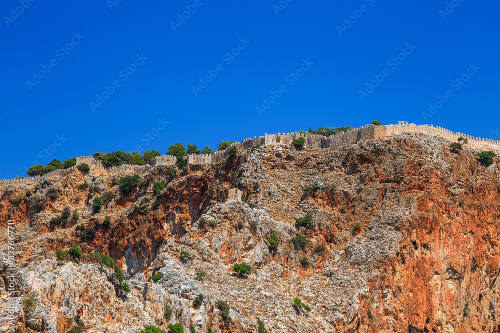 Rocks and the medieval fortress of Alanya, Turkey