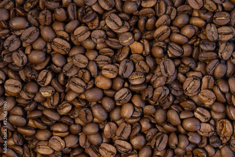 Big group of roasted coffee beans in detail