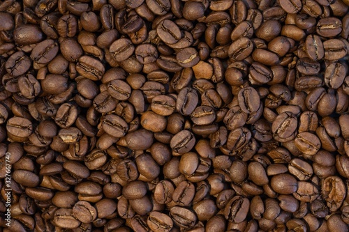 Big group of roasted coffee beans in detail
