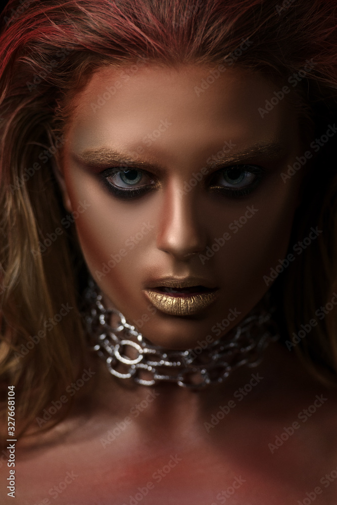 Portrait of a girl with a chain and creative make-up Portrait of a girl with a chain and creative make-up