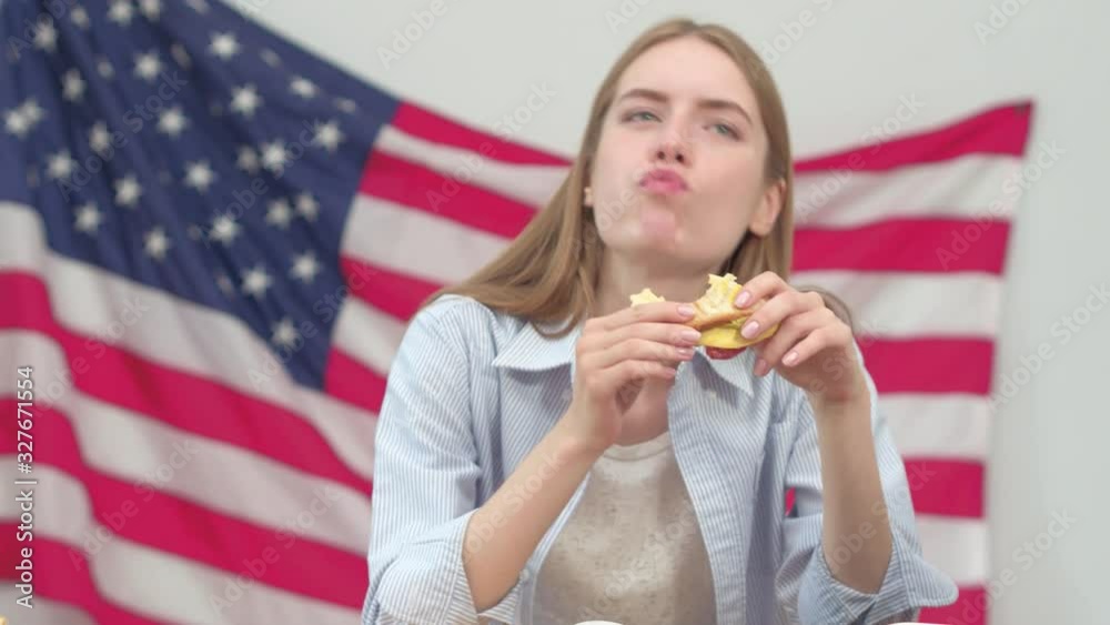 Beautiful Blond Girl Enjoying Eating A Sandwich And Drinking Juice At The Office Or Home While She Working Or Studdying Beautiful Blond Girl Enjoying Eating A Sandwich And Drinking Juice At The Office Or Home While She Working Or Studdying