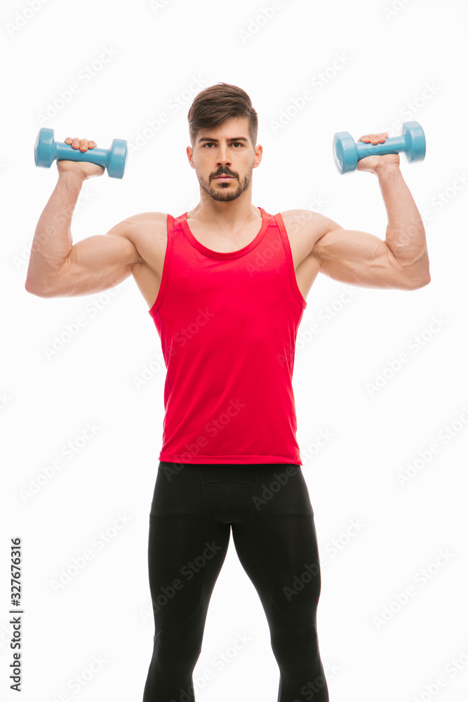 Fitness man exercising in studio Fitness man exercising in studio
