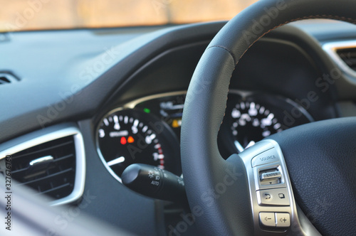 Close-up of a steering wheel and a dashboard