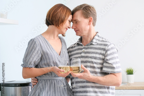 Beautiful couple with glass...