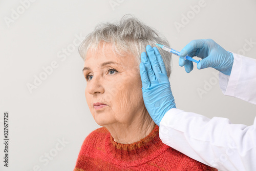 Senior woman with hair loss...