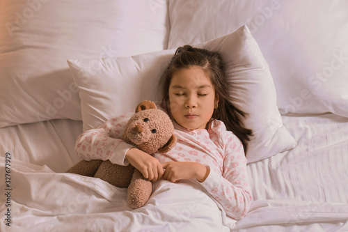 Cute little Asian girl slee...