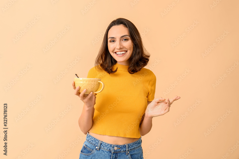 Young woman with tasty yogurt on color background Young woman with tasty yogurt on color background