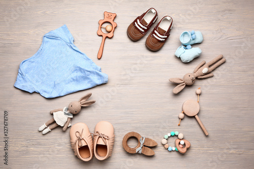 Frame made of baby clothes ...