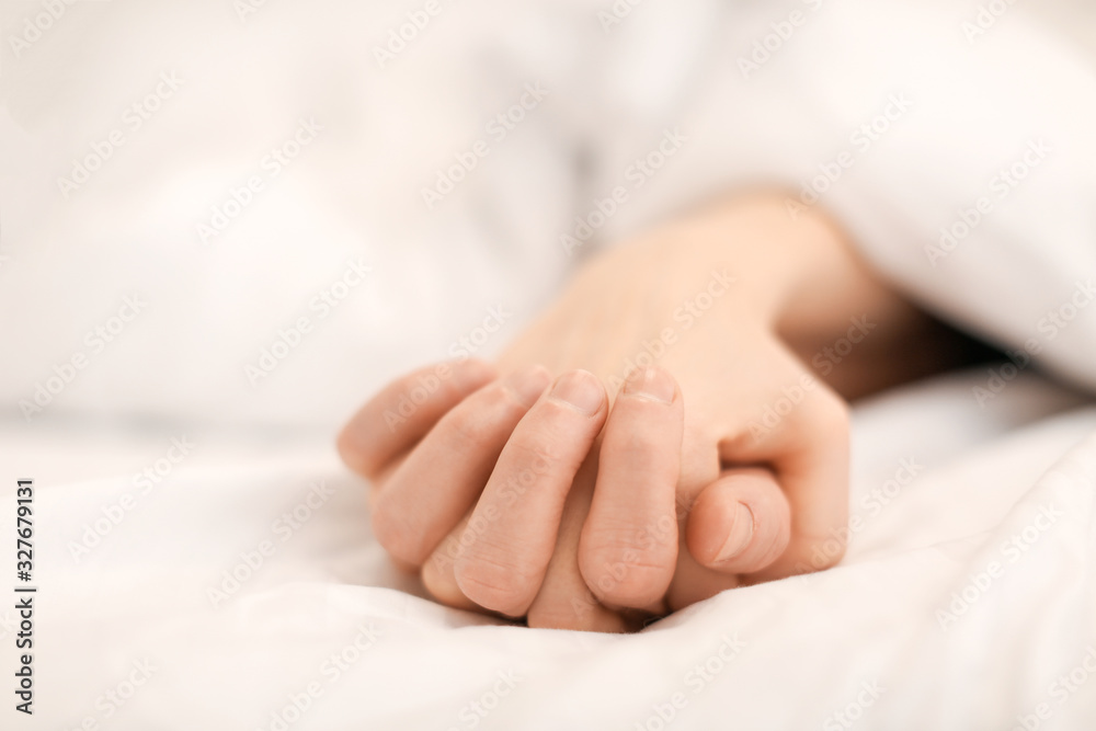 Hands of young couple sleeping in bed Hands of young couple sleeping in bed