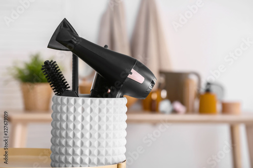 Modern blow dryer and hairdresser tools in salon