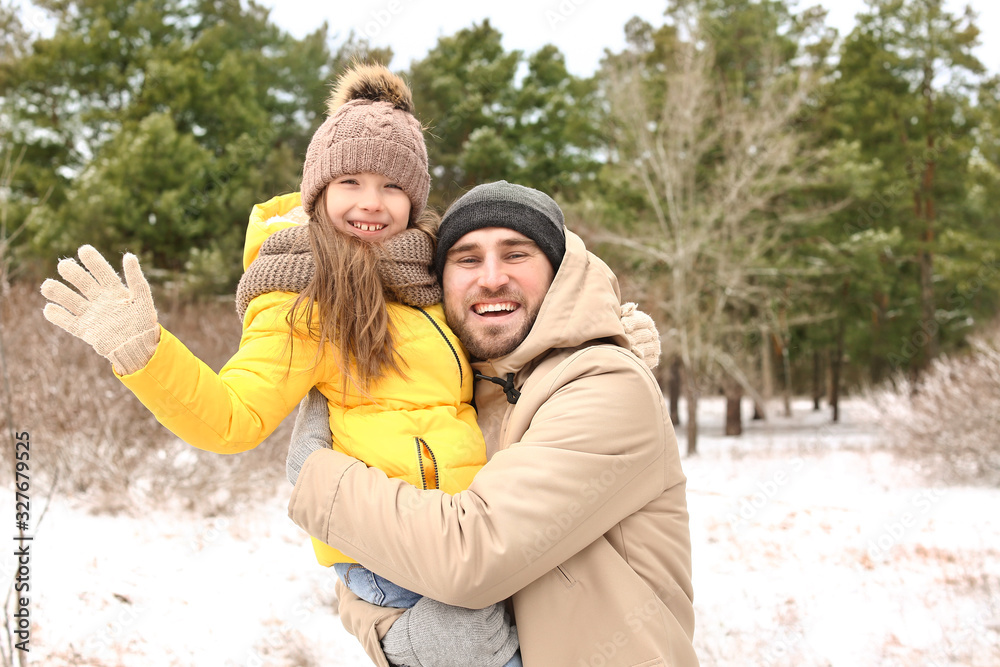 Fototapeta premium Father with little daughter in park on winter day