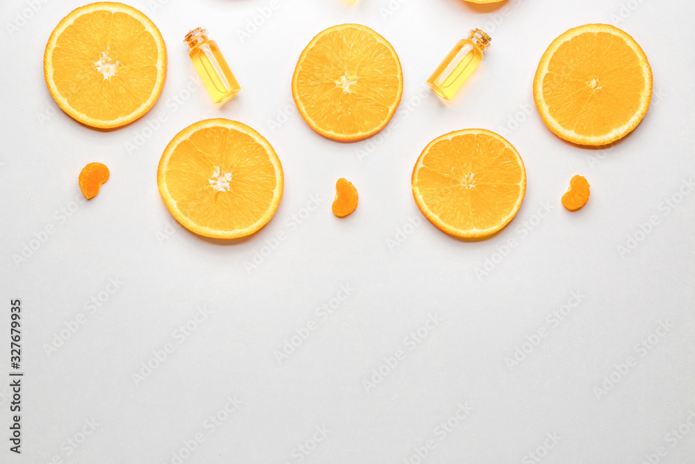 Composition with citrus essential oils on white background Composition with citrus essential oils on white background