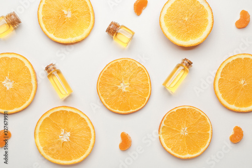 Composition with citrus essential oils on white background