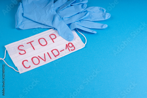 Surgical mask protective mask. The Chinese outbreak of coronavirus. Coronovirus Quarantine Concept. Surgical mask protective mask with text Stop COVID-19 .Chinese Coronavirus, wuhan virus.Stop coronav photo