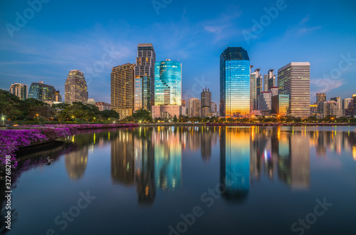 Lake in City Park under Skyscrapers at Twilight. Benjakiti Park in Bangkok, Thailand © kaycco