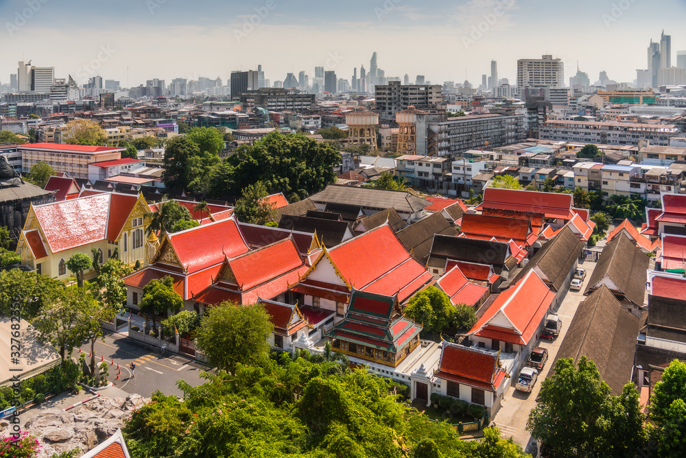 Traditional Thai Architecture with Modern Buildings and Skyscrapers in Background. Cityscape of Bangkok, Thailand as Seen from Temple of the Golden Mount (Wat Saket).
