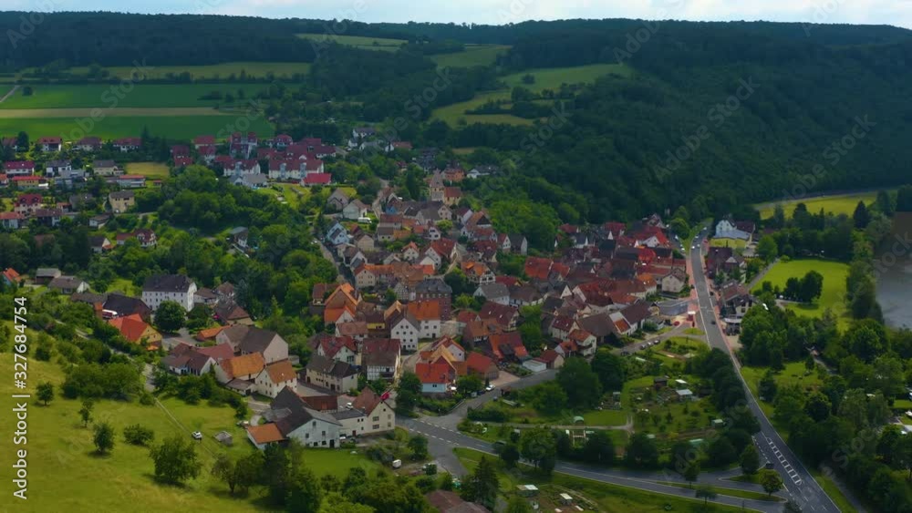 Aerial view of the village Urphar beside the Main river in Germany, on a sunny day in spring. Very wide view of the whole town with pan to the right. Aerial view of the village Urphar beside the Main river in Germany, on a sunny day in spring. Very wide view of the whole town with pan to the right.