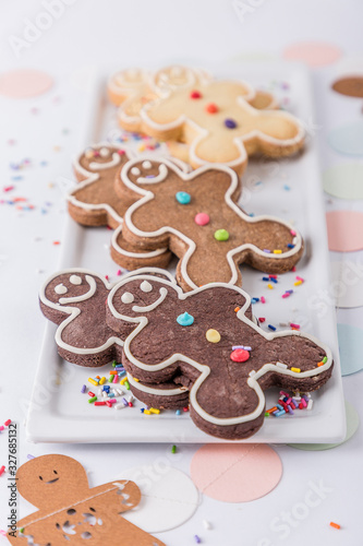 Pattern of traditional handmade smiling biscuits gingerbread men cookies