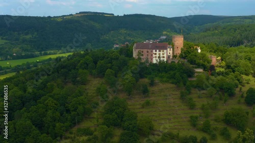 Aerial view of the  village and castle Gamburg in Germany. Zoom in and pan to the right beside the castle. photo