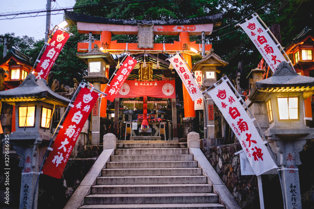 Sanctuary with lamps and flags at Fushimi Inari taisha shrine, Kyoto Sanctuary with lamps and flags at Fushimi Inari taisha shrine, Kyoto