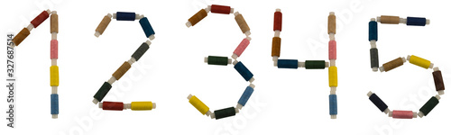 Isolated Font set of numbers 1-5 made of colorful spools of thread for sewing on white background