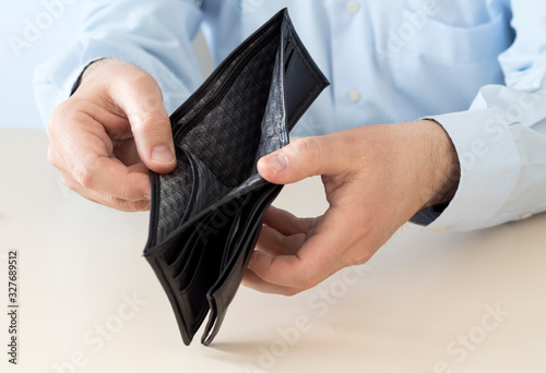  Business Person holding an empty wallet. photo