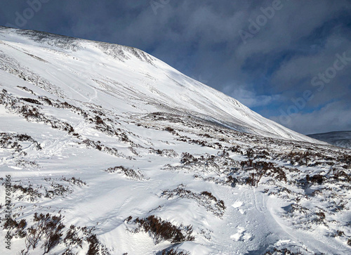 Scottish snowy mountain landscape. Cairngorms National Park, Scotland..