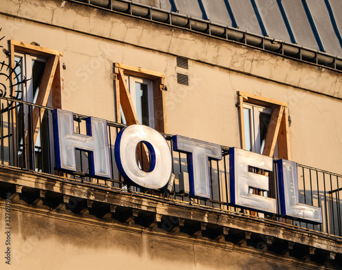 Paris: Hotel sign on the facade of old hausmannian building in central Paris - romantic French city warm sunset colors photo