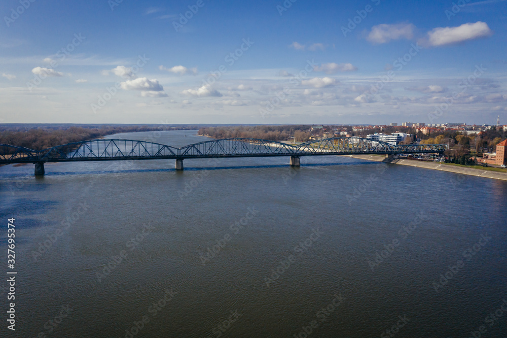 Drone view on the River Vistula and Jozef Pilsudski bridge in Torun city in Poland