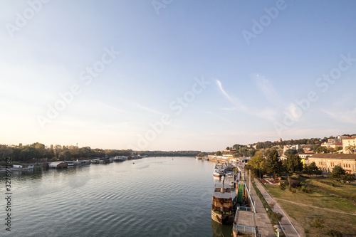 View of Sava river bank in Belgrade, Serbia, with the Kalemegdan fortress on the background and boats and ships in front, as well as the major landmarks of the old town (stari grad) photo