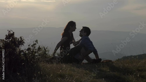 Young passionate couple making love in nature