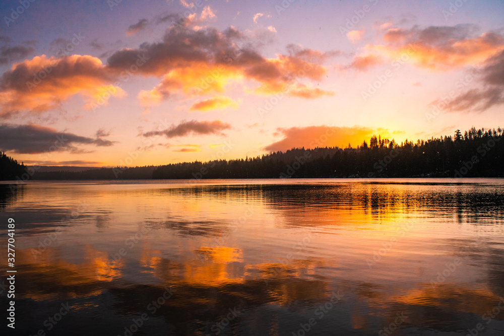 colorful sunrise on a calm lake