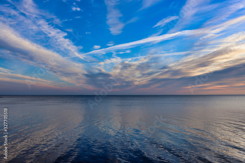 background. Beautiful sunrise on the sea   lake   river. blue sky with white clouds